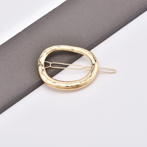 Broche Dorado Ovalado "Aura"