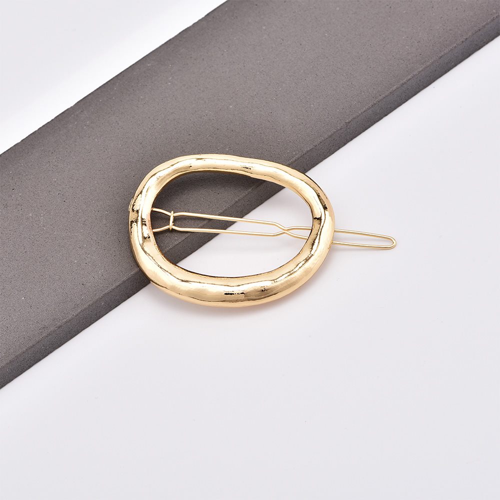 Broche Dorado Ovalado "Aura"