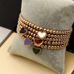 Pulsera de Cuentas Doradas con Dije de Corazón